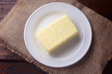 fresh organic farm yellow butter made with cow's milk on rustic wooden table