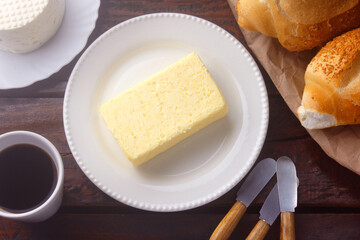 fresh organic farm yellow butter made with cow's milk on rustic wooden table