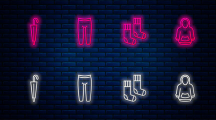 Set line Leggings, Socks, Umbrella and Hoodie. Glowing neon icon on brick wall. Vector