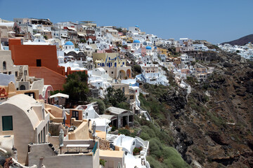 Fototapeta na wymiar Oia Town at beautiful Greek island Santorini in Greece. Oia is a small town and former community in the South Aegean on the Santorini.