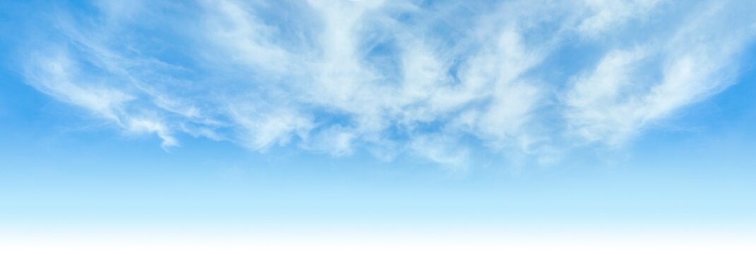 Big blue sky background with clouds