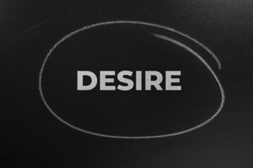 The Word desire Written On The Chalkboard. desire concept background.