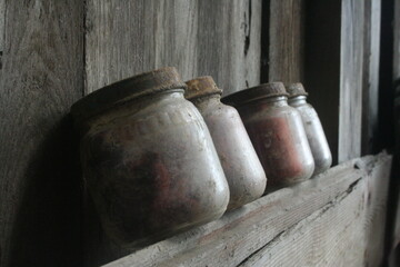 Antique Jars Resting on a Wood Wall