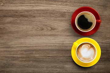Papier Peint photo Café Black coffee and Latte Coffee or Cappuccino Coffee in red and yellow cup on wooden table, Flay lay wooden desk with coffee with copy space