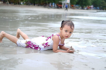 child playing on the beach