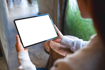 Mockup image of a woman holding digital tablet with blank white desktop screen