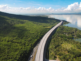 Drone aerial photographs of roads, highways in mountains and reservoirs.