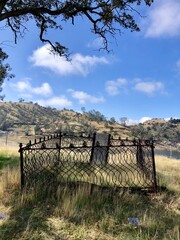 a historic cemetery with a grave marker dating back to the 1800's near millerton lake state park outside of friant, fresno county, california