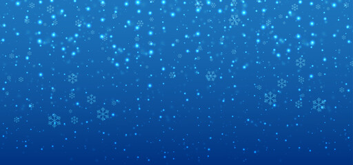 Christmas background with blue light and snowflakes