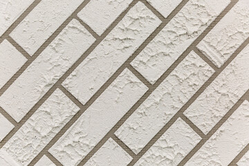Diagonal gray brick wall surface. Construction, renovation and interior design. Background. Space for text.