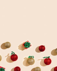 Happy holidays, Merry Christmas, New Year background with copyspace. Bright pattern with shiny red and golden Christmas balls and gift box