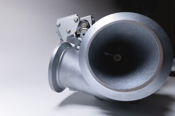 Close-up of an auto part for an internal combustion engine. Gas turbine. Turbo supercharger new on...