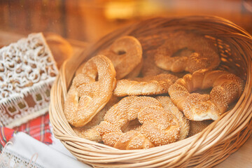 A bakery showcase in a European city for Christmas. Gingerbread house, pretzel, apple crumble, buns. Bread on Christmas and New year