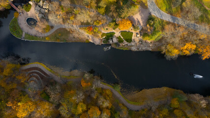 Aerial view of the waterfall in autumn park with big stones, from above. Sofiivka park in Uman, Ukraine