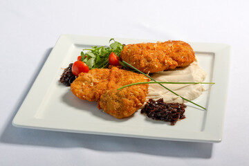 Deep fried chicken fillet served with mashed potato