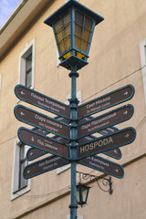 old street lamp with direction indicators