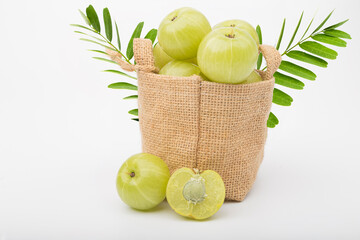 Gooseberry in sackcloth isolated on white background.