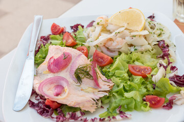 Seafood salad with salmon and vegetables