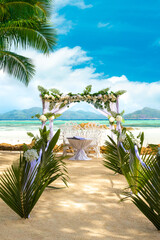 Beach wedding gazebo decorated with flowers on the most beautiful beach of Seychelles.La Digue, Seychelles
