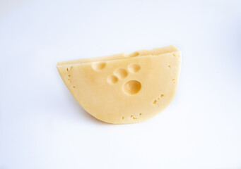 Piece of Semi Hard Cheese on white Slice Segment of cheese Wheel isolated Over white background Dairy Product Concept