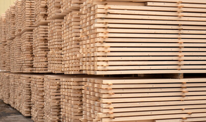 Lumber warehouse. Wooden boards in a stack