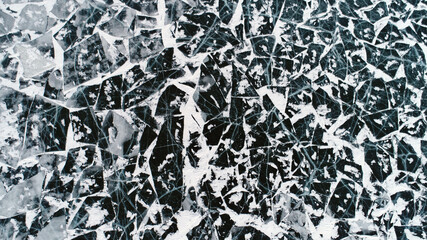 Lake Baikal ice texture. Cracks in the ice. Frozen Lake Baikal.