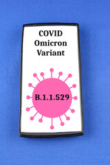 Covid Omicron Variant B11529 warning on a mobile phone isolated on a blue background - 471644403