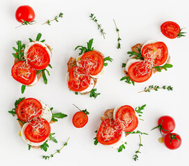 Pattern of mozzarella and tomato open sandwiches. Flat lay. Italian cuisine