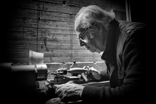 Old carpenter work on a lathe. Black and white picture close up