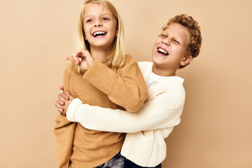cute stylish kids hug games smile friendship beige background