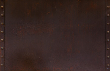Background image of a dark red rough old iron plate