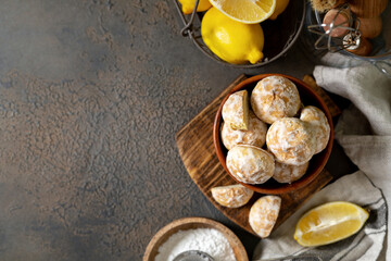 Lemon gingerbread in a wooden bowl on a dark culinary background. Delicious homemade cookies top view