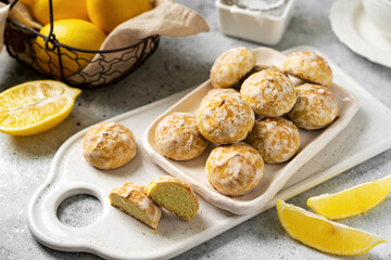 Lemon gingerbread in a white plate on a light gray culinary background. Delicious homemade cookies closeup