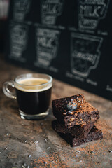 Chocolate brownie with blueberry on dark background
