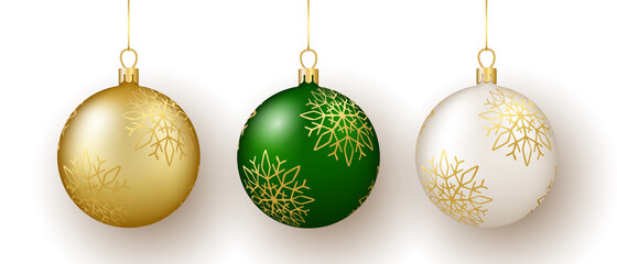 Christmas and New Year decor. Set of gold, white and green snowflake ornament balls on ribbon.