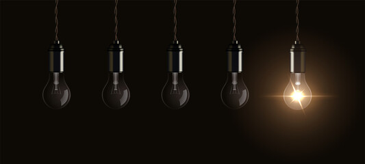 Fototapeta na wymiar Light bulbs hang from ceiling with one bright lightbulb glowing, symbol of innovation