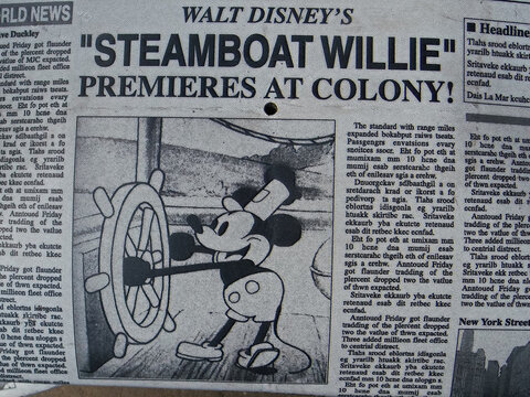 Display of An old newspaper reporting on Mickey Mouse's success in Walt Disney World. 