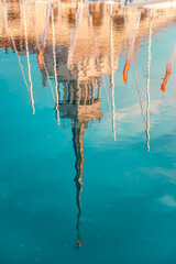 reflection of the historic architecture of the building on the river