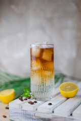 cold cocktail with ice espresso tonic glass with lemon