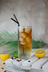cold cocktail with ice espresso tonic glass with lemon