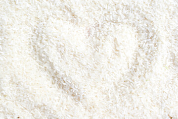 Fototapeta na wymiar jasmine rice grain white rice grain background drawing heart