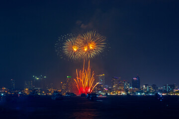 fantastic and colorful fireworks display over the night sky of the city during a festival