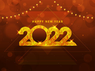 Golden Foil Effect 2022 Number With Lighting Garland Decorated On Brown Bokeh Light Effect Background.