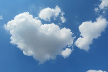 Naklejka na ściany i meble Beautiful heart shaped cloud in blue sky