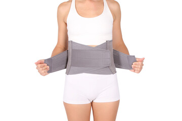 Orthopedic lumbar corset on the human body. Back brace, waist support belt for back. Posture...