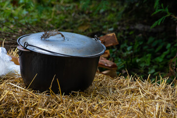 Hiking pot in the bonfire. Traveling in the mountains with tents