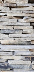 Wall of stone plates. Stone wall texture. Stone bricks. Stone wall background.