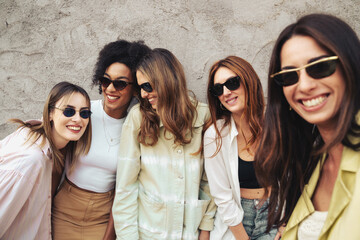 Group of beautiful women with sunglasses having fun together