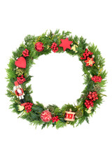 Fototapeta na wymiar Christmas wreath with fun ornaments, tree decorations, holly, ivy, mistletoe and cedar leaves on white background. Festive composition for Xmas and New Year. 