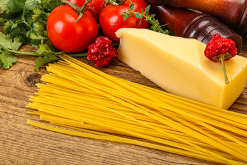 Raw Italian spaghetti heap with cheese